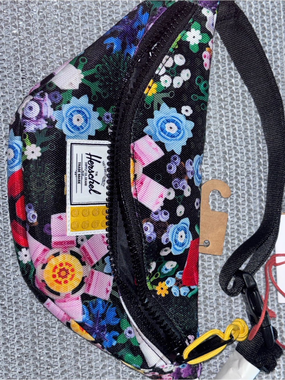 Little Herschel Supply Co. x LEGO Classic Hip Pack in the Garden Floral pattern